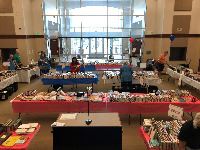 A room full of used books on tables
