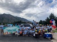 People standing around a parade entry