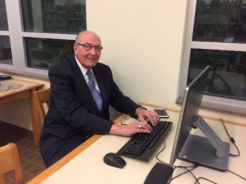 Lowell Nelson sitting at a computer